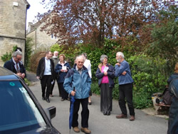 Our visitors assemble for Bisley Well Dressing